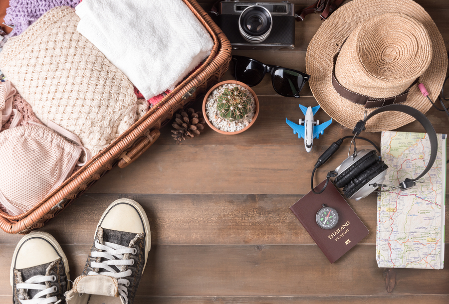 Travel accessories costumes. Passports luggage vintage camera sunglasses wicker bag sneaker The cost of travel maps prepared for the trip