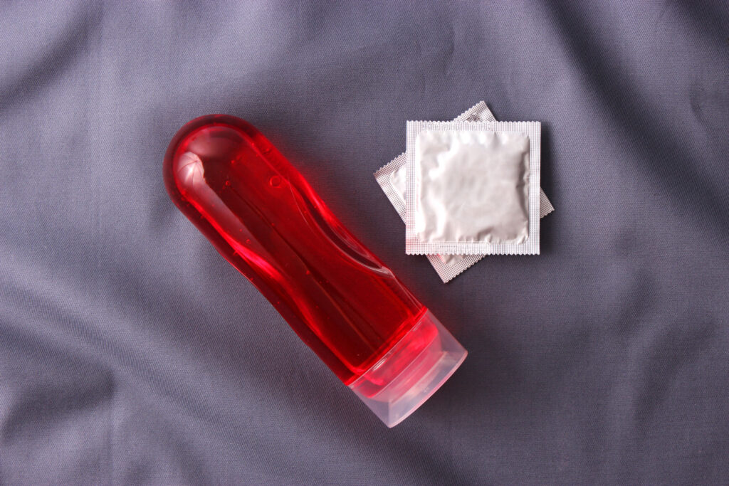 An intimate lubricant for comfortable sex close-up on a colored background.